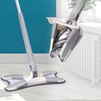 X-Type mop in use cleaning tile floor in Pakistan home